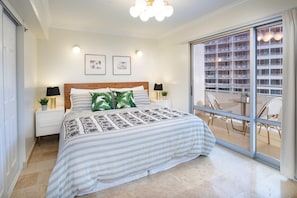 Main bedroom with king size bed and lanai/balcony access