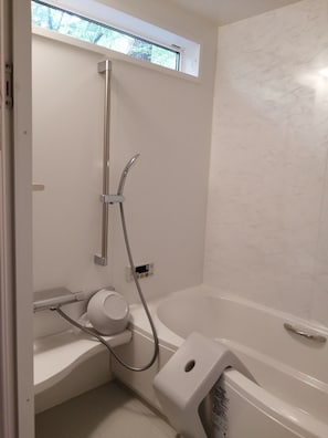 Simple bathroom with a large shower head