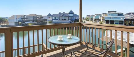 Wow, what a great space for morning coffee!   Balcony off master bedroom, which is upstairs.
