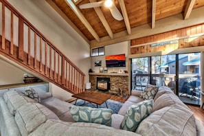 The skylights and sliding glass doors to the balcony fill the living room with natural light.