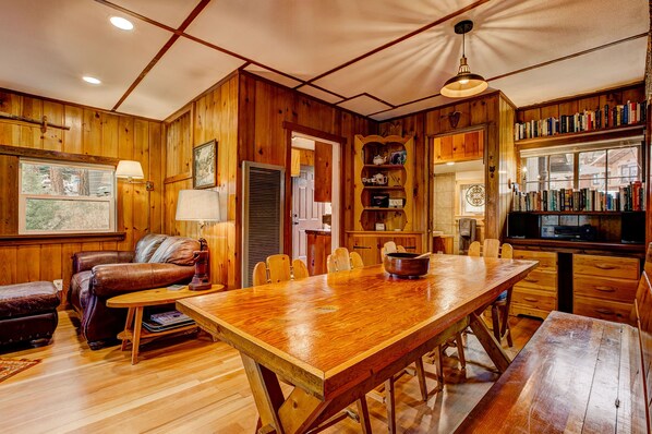 Open living space, large dining table and restored 100 year old wood floors.