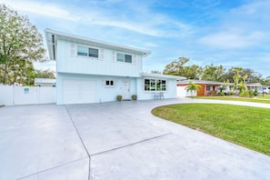 Large U-shaped driveway with enough room to fit 4 cars. The far-left side of the driveway is reserved for guests that book the attached apartment unit.