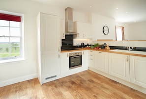 First floor: Open-plan kitchen, dining and sitting room area