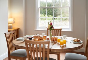 Ground floor: Dining table with seating for four guests