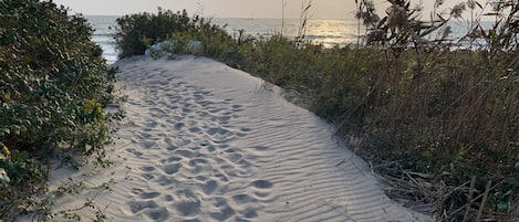 This path to the private beach is just a short walk from your beach house.