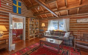 Living room has comfortable seating, Scandanavian touches, books for your down time.