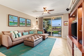 Living Room with Sectional Sofa, 3 Wall Paintings, and Views of the Golf Course