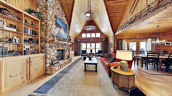 Enjoy views of beautiful long lake from this comfy livingroom