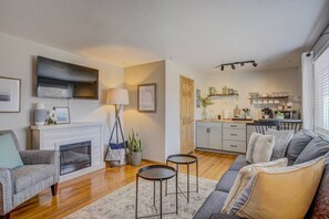 Cozy living space with fully stocked kitchenette.