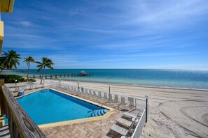 Pool with chaise lounge chairs overlooking a rare Florida Keys Beach