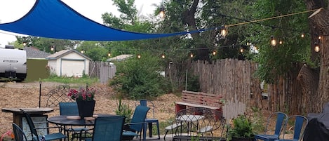 Welcome to the Patio! Enjoy gas grill, fire pit, al fresco dining, sun shade.