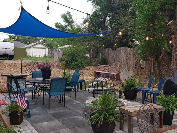 Welcome to the Patio! Enjoy gas grill, fire pit, al fresco dining, sun shade.