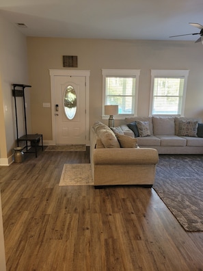 Living room w/sleeper sofa and hall tree