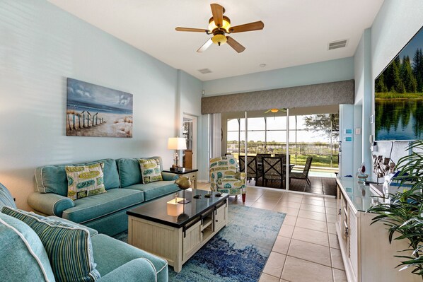Living room is a coastal theme with large flat screen TV