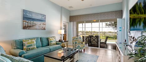 Living room is a coastal theme with large flat screen TV