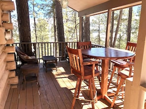 Dine Fresco-style under the covered deck, enjoy peek-a-boo views mountain/lake.