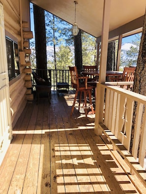 Relish in time spent under the large covered deck w/peek-a-boo views of the lake