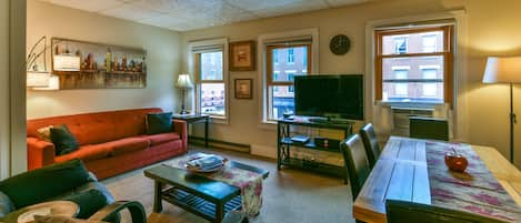 Sun filled living room that overlooks historical Main Street