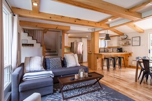 Chalet Scandinavian living, dining, and kitchen spaces