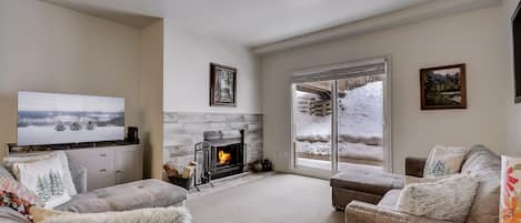 Wood burning fireplace in living area