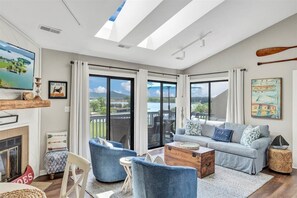 Skylights and cathedral ceilings bathe the living room with sunshine and light