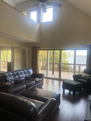 Living room and doors to the master bedroom on the left side of picture