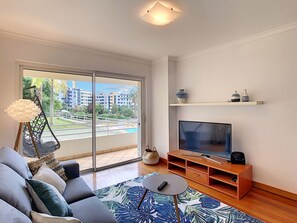 Stylish and comfort living room #tropicalstyle #smartTV #balcony #pool