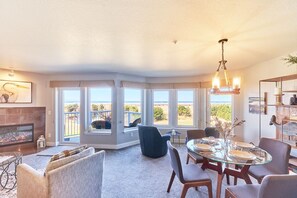 All Waves & Forever living room with wall to wall windows