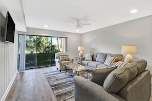 Living Room - Large living room has sliding glass door leading out to the outdoor patio.