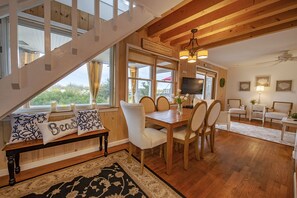 Open, airy first-floor living space provides comfortable seating for your guests!