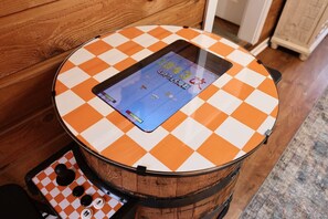 60 game barrel arcade in the foyer.