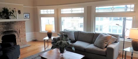 Tons of natural light,9 foot cove ceilings,hardwood floors,and fireplace.