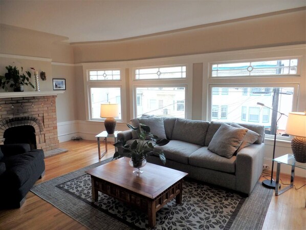 Tons of natural light,9 foot cove ceilings,hardwood floors,and fireplace.