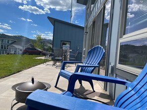 Large patio with BBQ, Fire Pit, Seating.