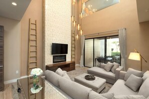 Nicely appointed living room a seating area and terrace