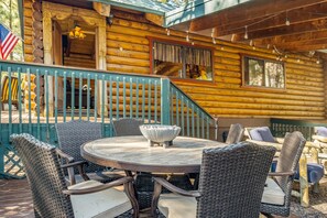 Front door and outside table with fire bowl and seating for 6