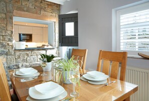 Ground floor: Spacious dining room with serving hatch to kitchen