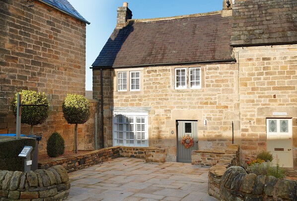 Devonshire Cottage, a lovingly restored sandstone cottage set in the idyllic village of Beeley