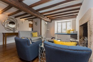 Ground floor: The cosy sitting room, with beautiful exposed beams
