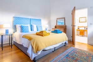 Bedroom one with a 6' super-king size zip and link bed, Smart television and en-suite bathroom