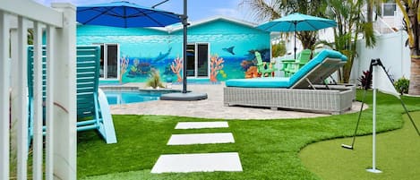 Check out the beautiful Mural poolside at Salty C Cottage!