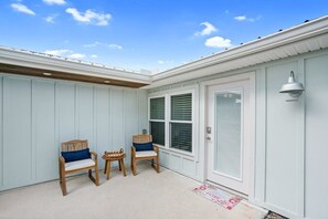 Courtyard entrance to the suite and seating area.