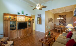 Puamana 25A | Princeville condos | living room and dining area - Kick your feet up in front of the flatscreen smart TV at the end of a long day, or enjoy a hot meal at the dining table (if it's takeout we won't tell!)