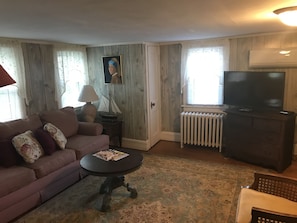 full living room area with 50" flat screen TV and Cable.