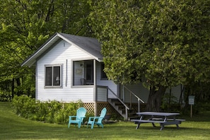 Each cabin has 2  lawn chairs,a charcoal grill & a picnic  table. 