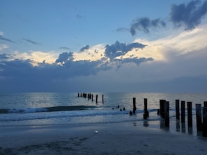 Perching pelicans as you step onto the beach.