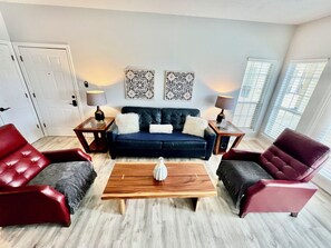 Living room with lakeview patio access