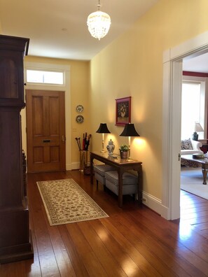 View of the front door from the main stairwell, which leads out to Maryland Ave.