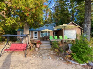 Sunny beachfront cottage with several places to relax. Just steps to the water. 