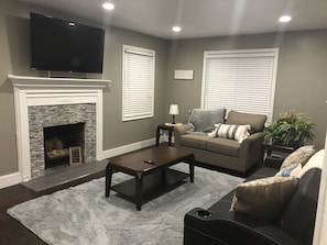 Living Room with 55" Smart TV - Amazon Prime Video & Crackle included.
